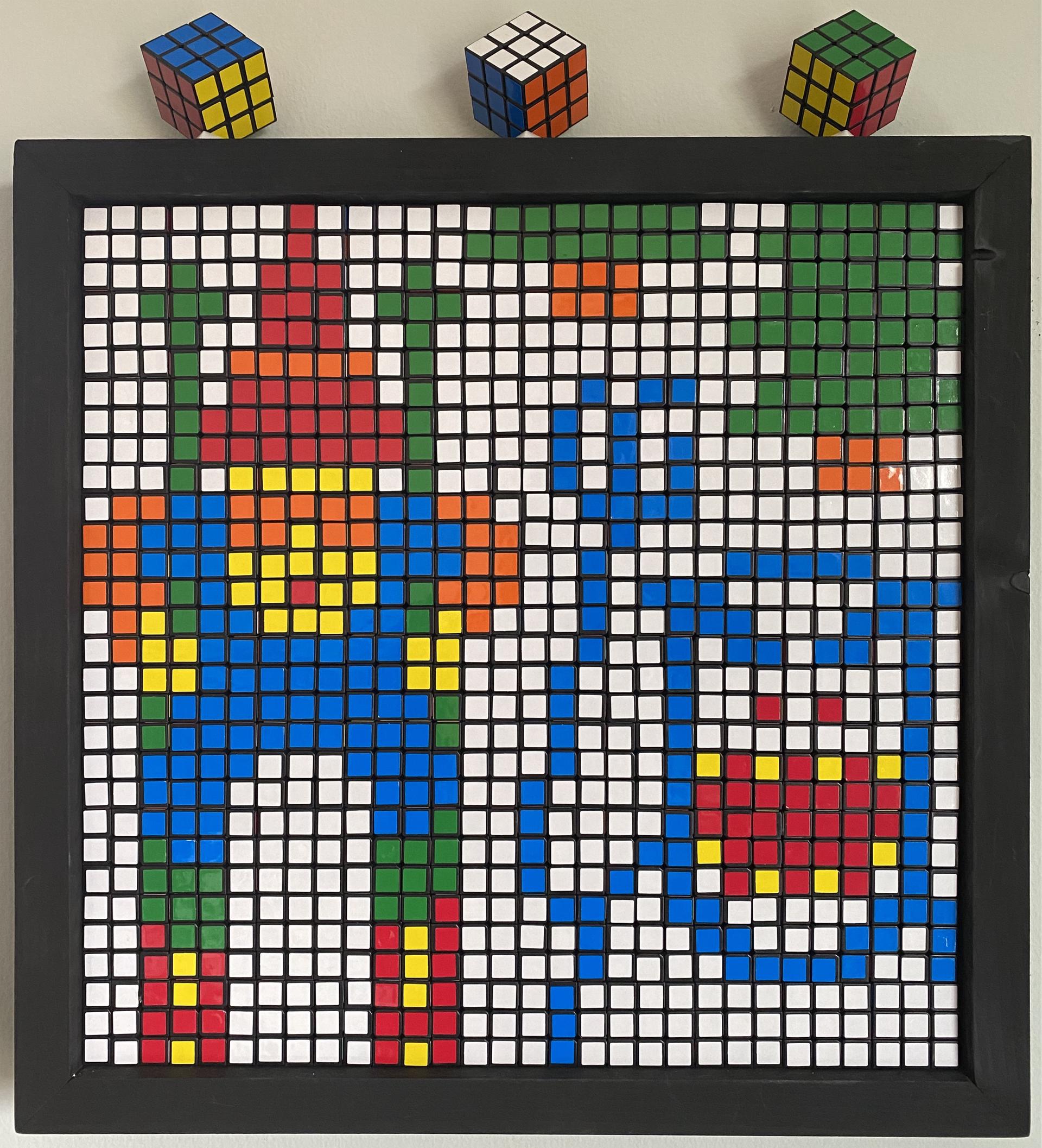 Rubik's cubes as pixel art of a skier, trees, and monster