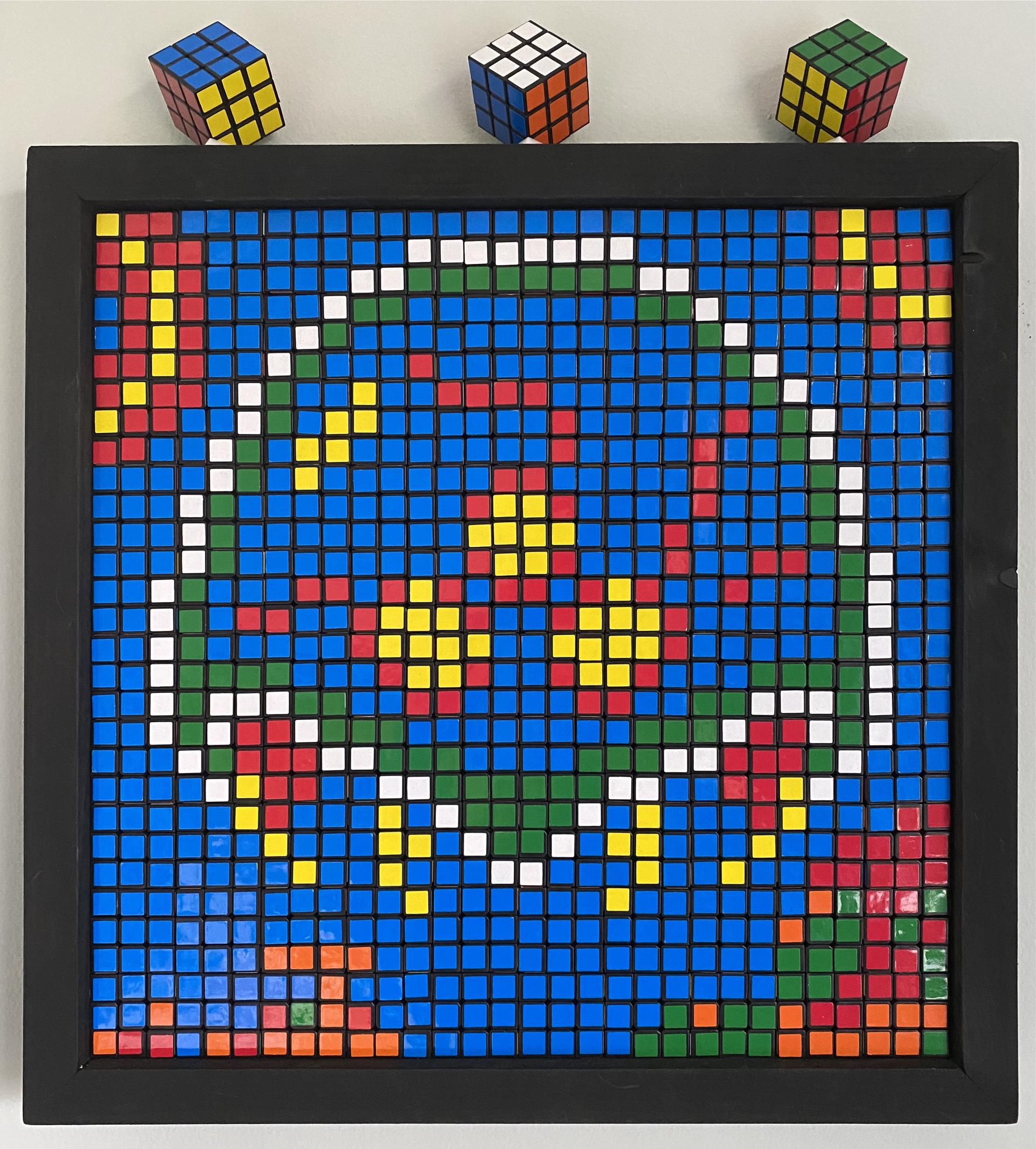 Rubik's cubes as pixel art of a Metroid surround by Rinka, Samus, and a missile.